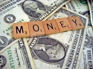 Money spelled out with scrabble tiles